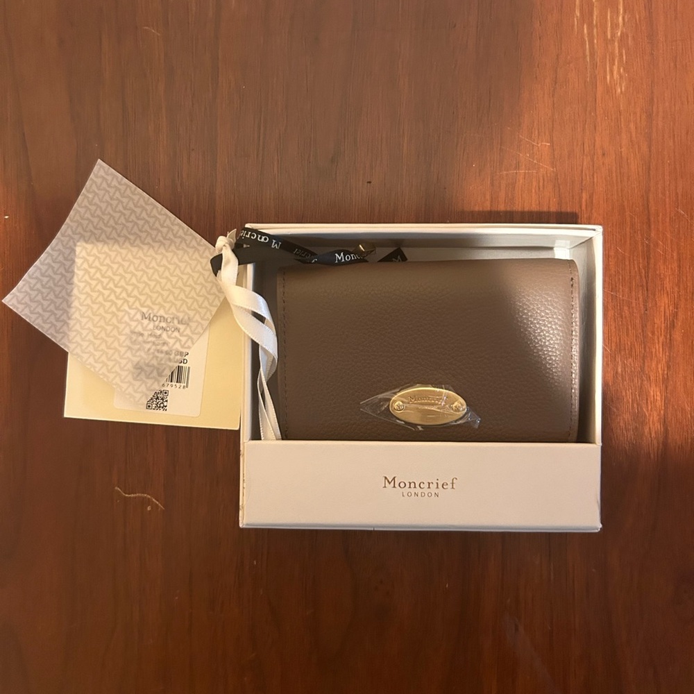 Light Brown leather Moncrief wallet with gold hardware.
